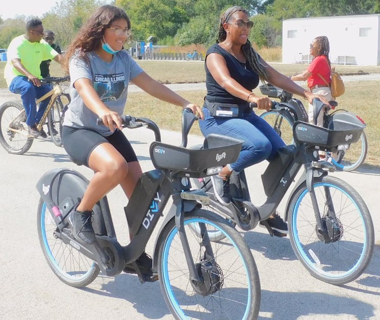 Mom and daughter biking with Divvy bikes at Big Marsh Park