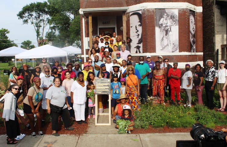 Blacks In Green volunteers posing in front of civil rights hero Emmett Till Museum in Woodlawn.