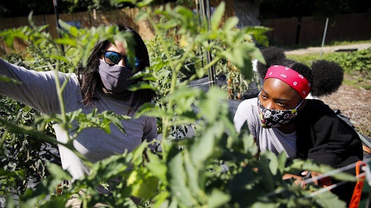 Student and mentor on the urban farm at the Gary Comer Youth Center.