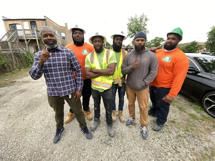 Construction workers at the site of IMAN's Go Green Community Fresh Market in Englewood.